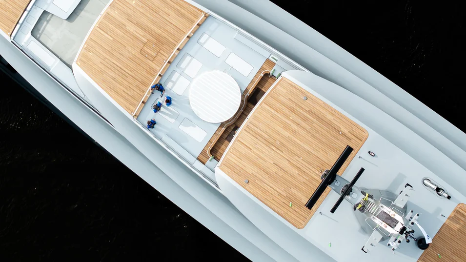 The Thalassa features teak decks and vertical teak strips accenting the superstructure