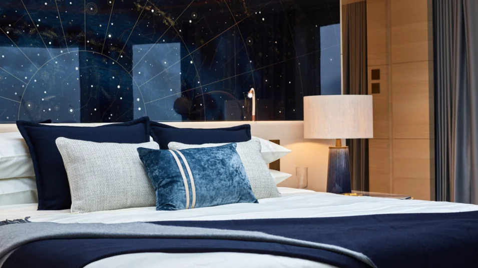 Artwork with a constellation map above the bed in the master suite on board the Heesen Sparta