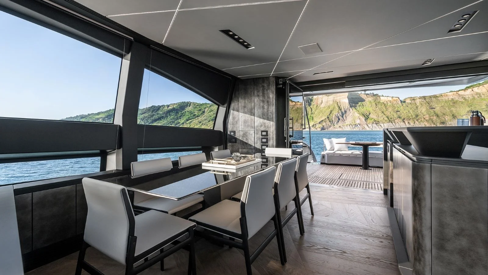 Dining area for eight guests opposite the galley