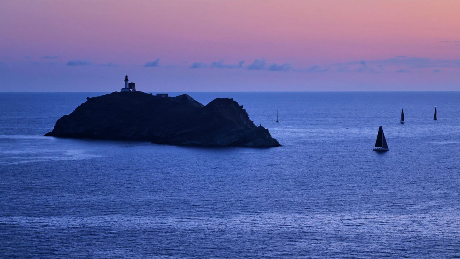 On the way to the finish line, the yachts go round the mythical Giraglia rock located at the northern tip of Corsica