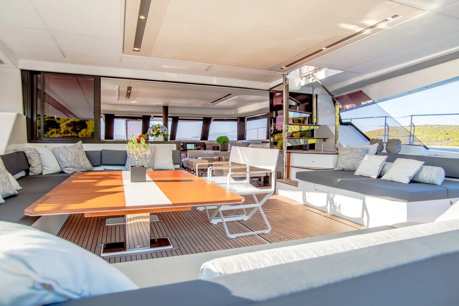 A really spacious aft cockpit and a saloon on Fountain Pajot Power 67 catamaran, which is less than 20 m
