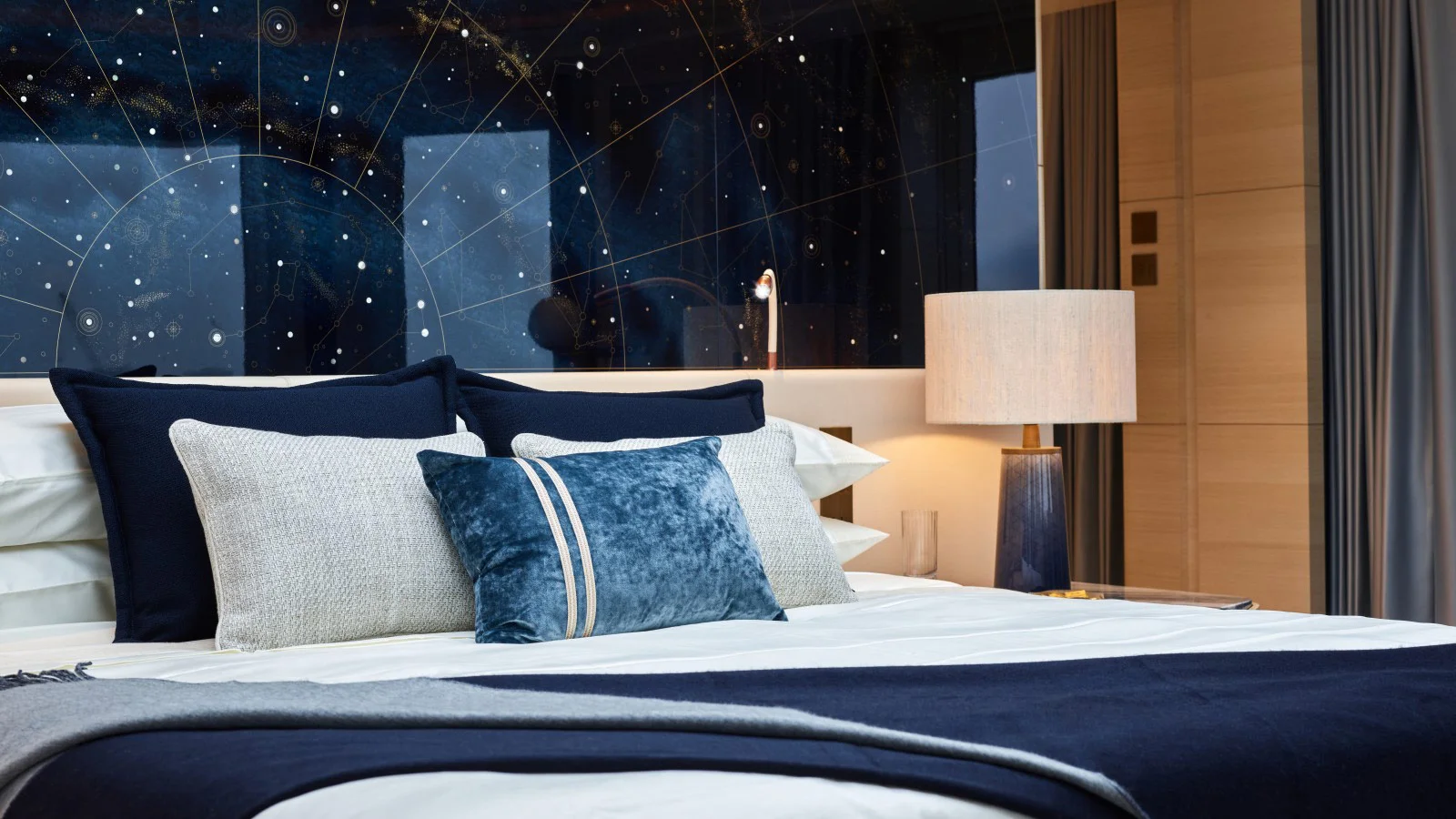 Artwork with a constellation map above the bed in the master suite on board the Heesen Sparta
