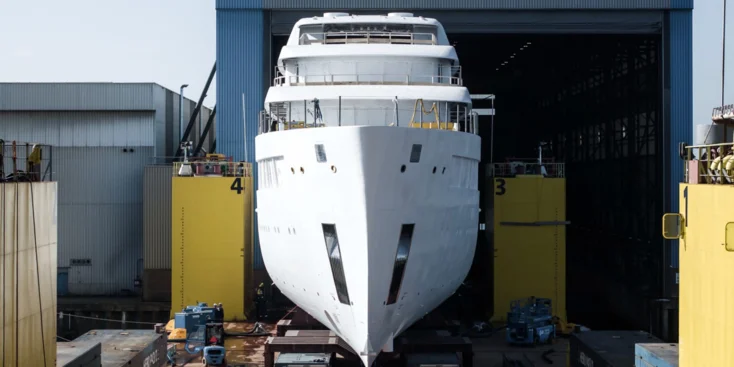 The 78-metre Feadship Project 716 leaving the shed