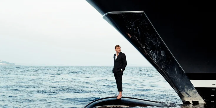 Espen Øino stands on the bulbous bow of the 72,1-metre superyacht Stella Maris (VSY, 2013)