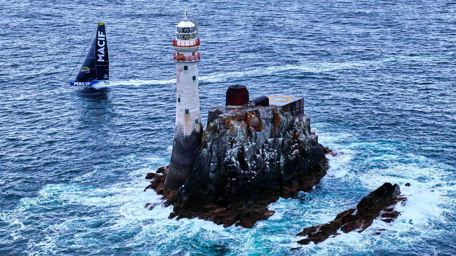 Charlie Dalin's IMOCA MACIF rounds the Fastnet Rock