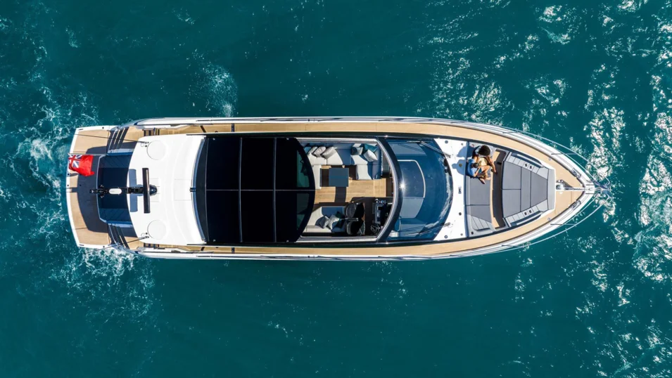 Retractable roof and sliding glass doors aft turn the interior space on the Sunseeker Predator 65 (20.50 m, 2022) into an exterior one